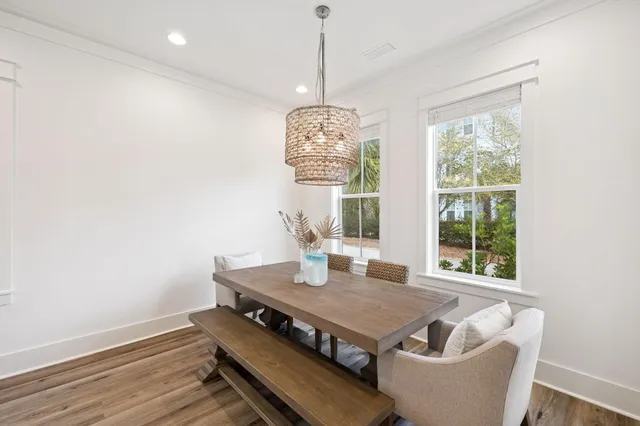 a view of entryway with wooden floor and front door