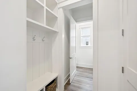 a bedroom with a bed and flat screen tv