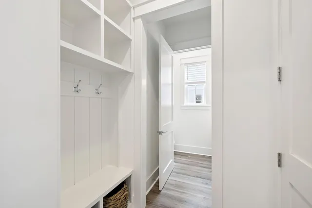 a bedroom with a bed and flat screen tv