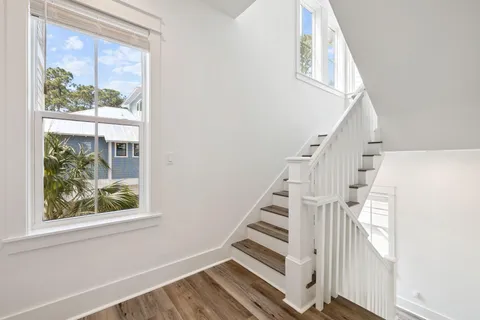 a white bath tub sitting next to a white toilet