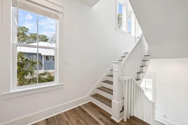 a white bath tub sitting next to a white toilet