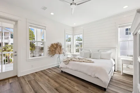 a bathroom with double vanity and a mirror