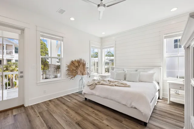 a bathroom with double vanity and a mirror