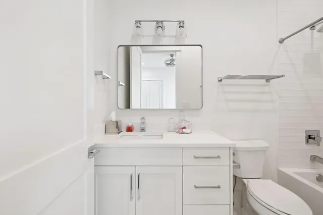a white bath tub sitting next to a window