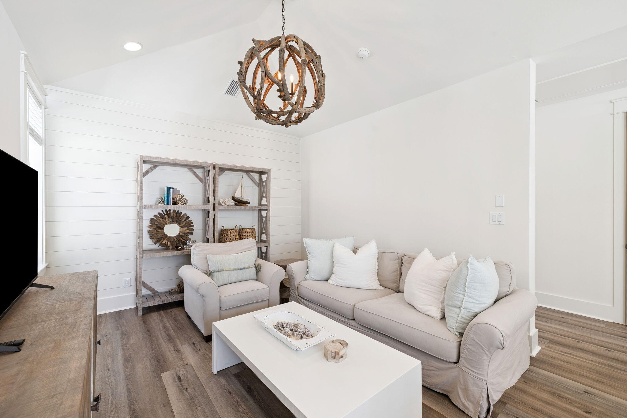 185 Redbud Ln Inlet Beach Inlet Beach, FL 32461 - Photo 40 of 71 a living room with furniture a wooden floor and a flat screen tv