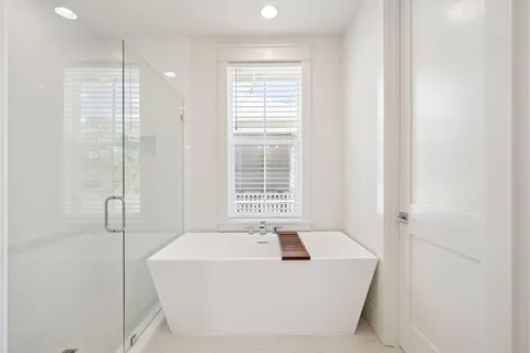 an aerial view of multiple houses with yard