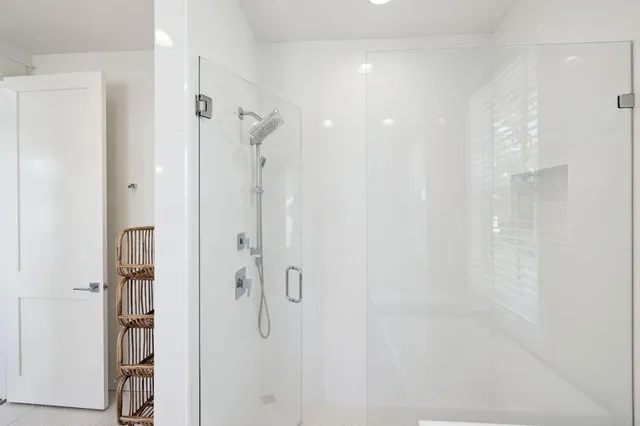 a view of a white house with a street