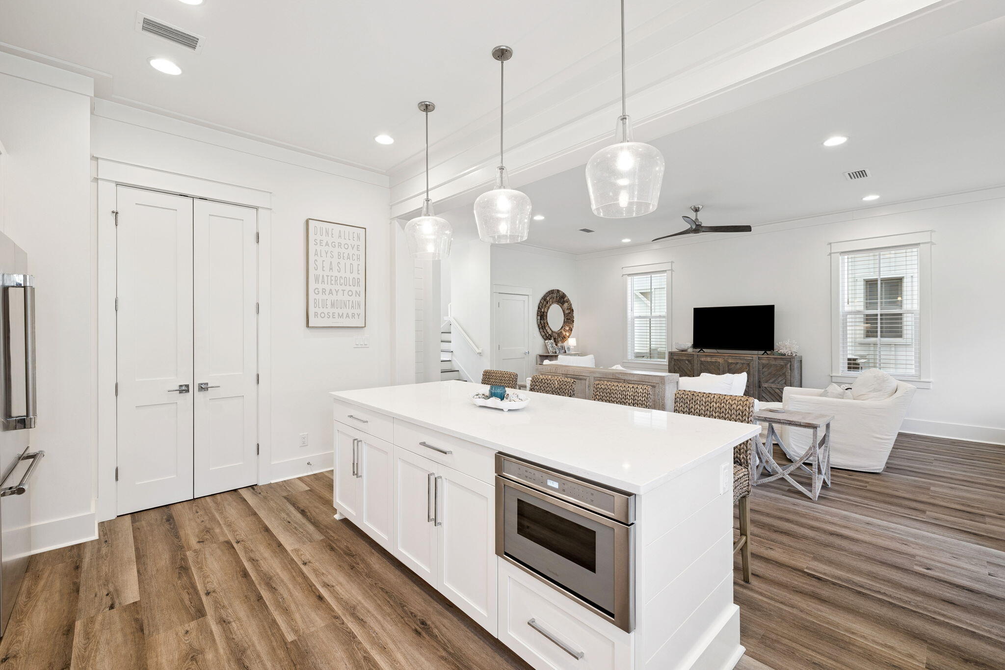 185 Redbud Ln Inlet Beach Inlet Beach, FL 32461 - Photo 8 of 71 a large room with kitchen island a stove a sink dishwasher and a dining table with wooden floor