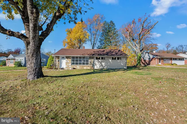 a house with trees in front of it