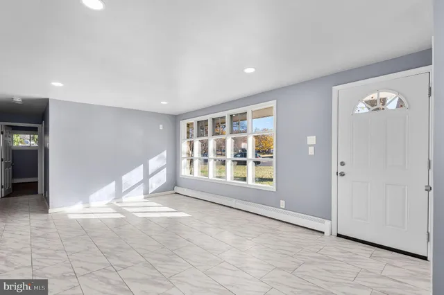 a view of an empty room with a window