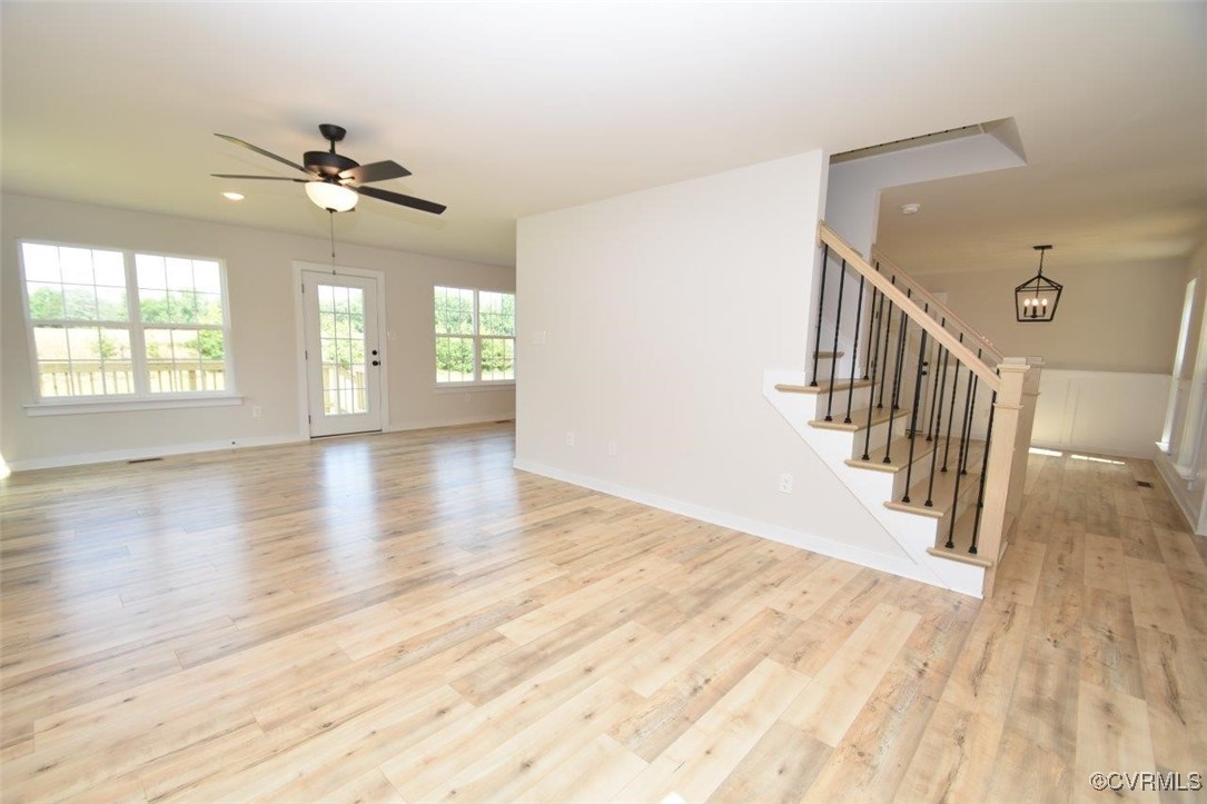 8729 Carters Mill Road Henrico, VA 23231 - Photo 23 of 33 Unfurnished living room with ceiling fan with nota