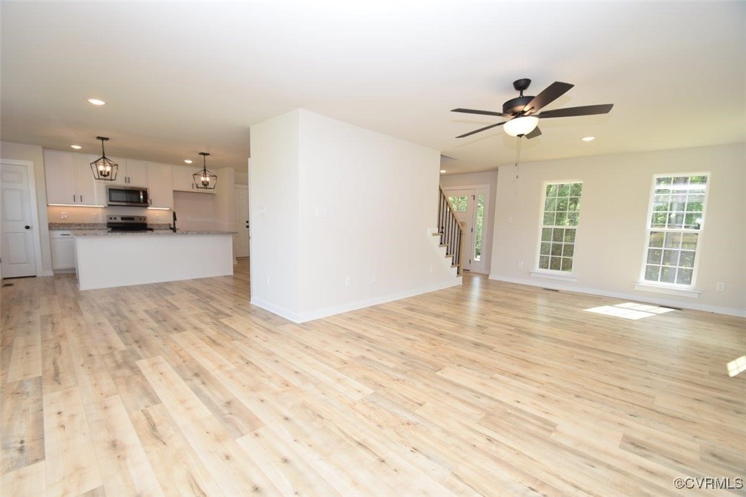 8729 Carters Mill Road Henrico, VA 23231 - Photo 24 of 33 Unfurnished living room with ceiling fan with nota