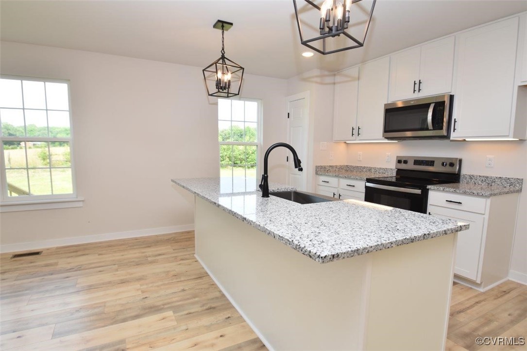 8729 Carters Mill Road Henrico, VA 23231 - Photo 26 of 33 Kitchen featuring light stone countertops, white c