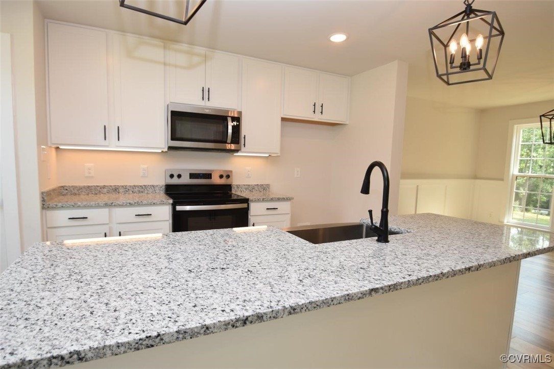8729 Carters Mill Road Henrico, VA 23231 - Photo 27 of 33 Kitchen with sink, hanging light fixtures, stainle