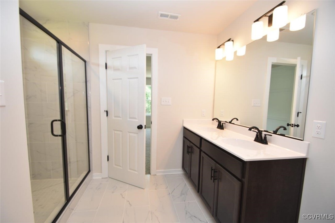 8729 Carters Mill Road Henrico, VA 23231 - Photo 3 of 33 Bathroom featuring vanity and walk in shower