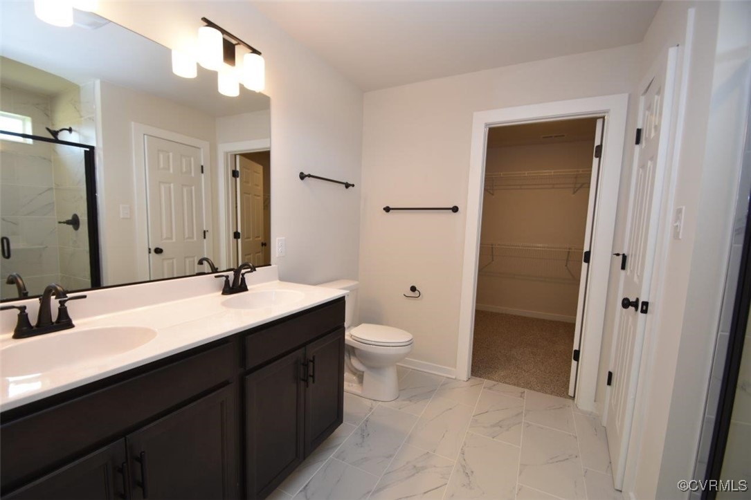 8729 Carters Mill Road Henrico, VA 23231 - Photo 8 of 33 Bathroom with vanity, toilet, and a shower with sh