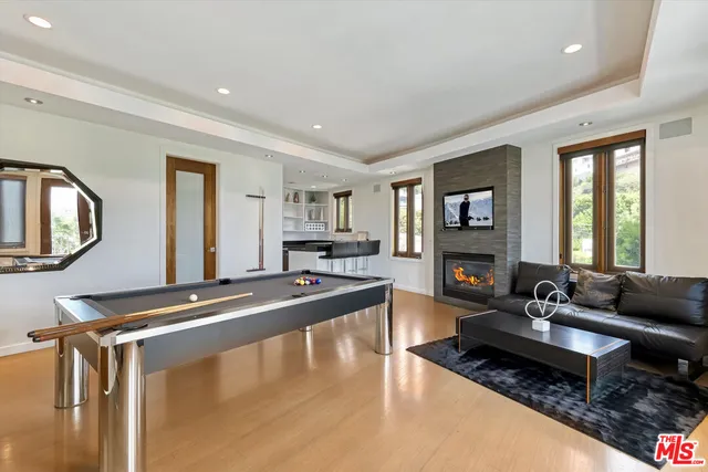 a living room with fireplace furniture and a flat screen tv