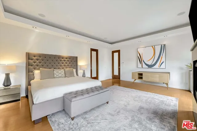 a bedroom with a bed and a couch