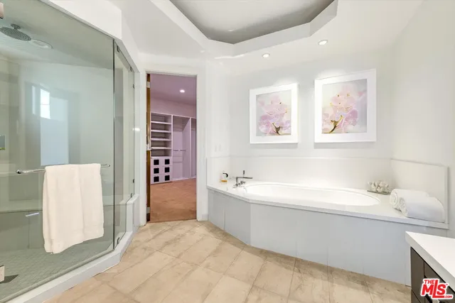 a bathroom with a bathtub and a sink