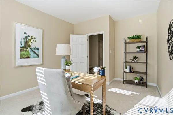 a living room with furniture and a table