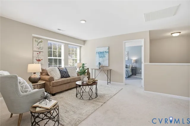 a living room with furniture and a table