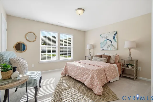 a bedroom with bed and a window