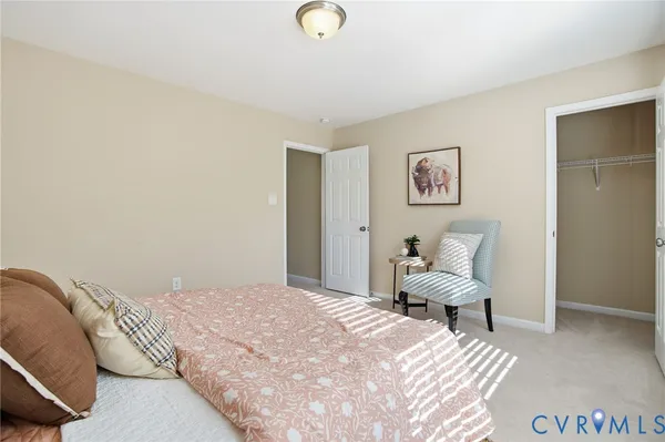 a bedroom with a bed and a chair