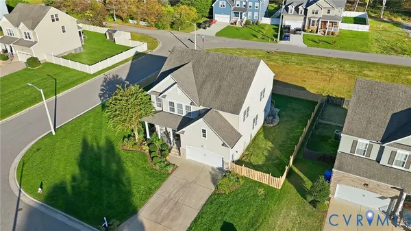 a aerial view of a house with a yard