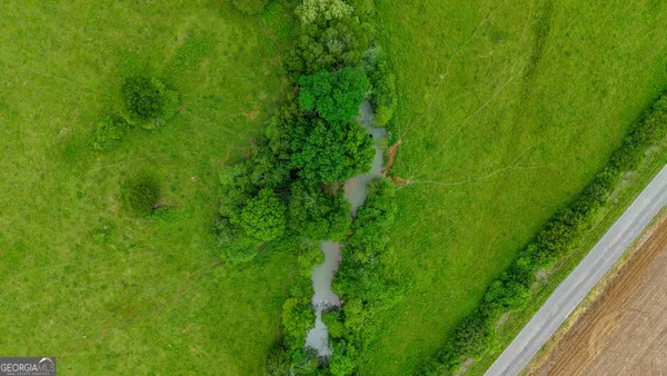 a view of a lake with a yard