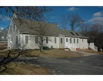 a view of house with backyard space