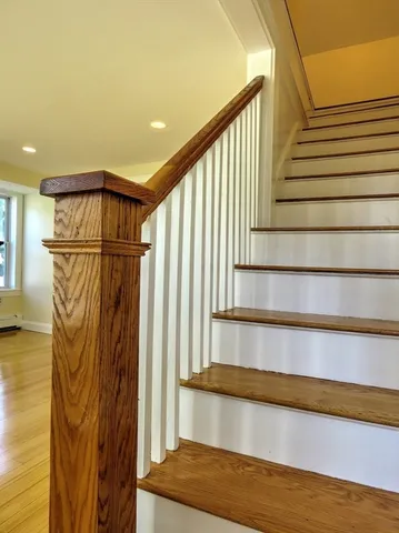 a view of a room with wooden floor and chair