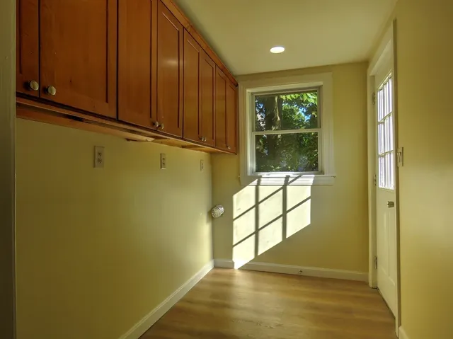 a view of outdoor space with wooden floor