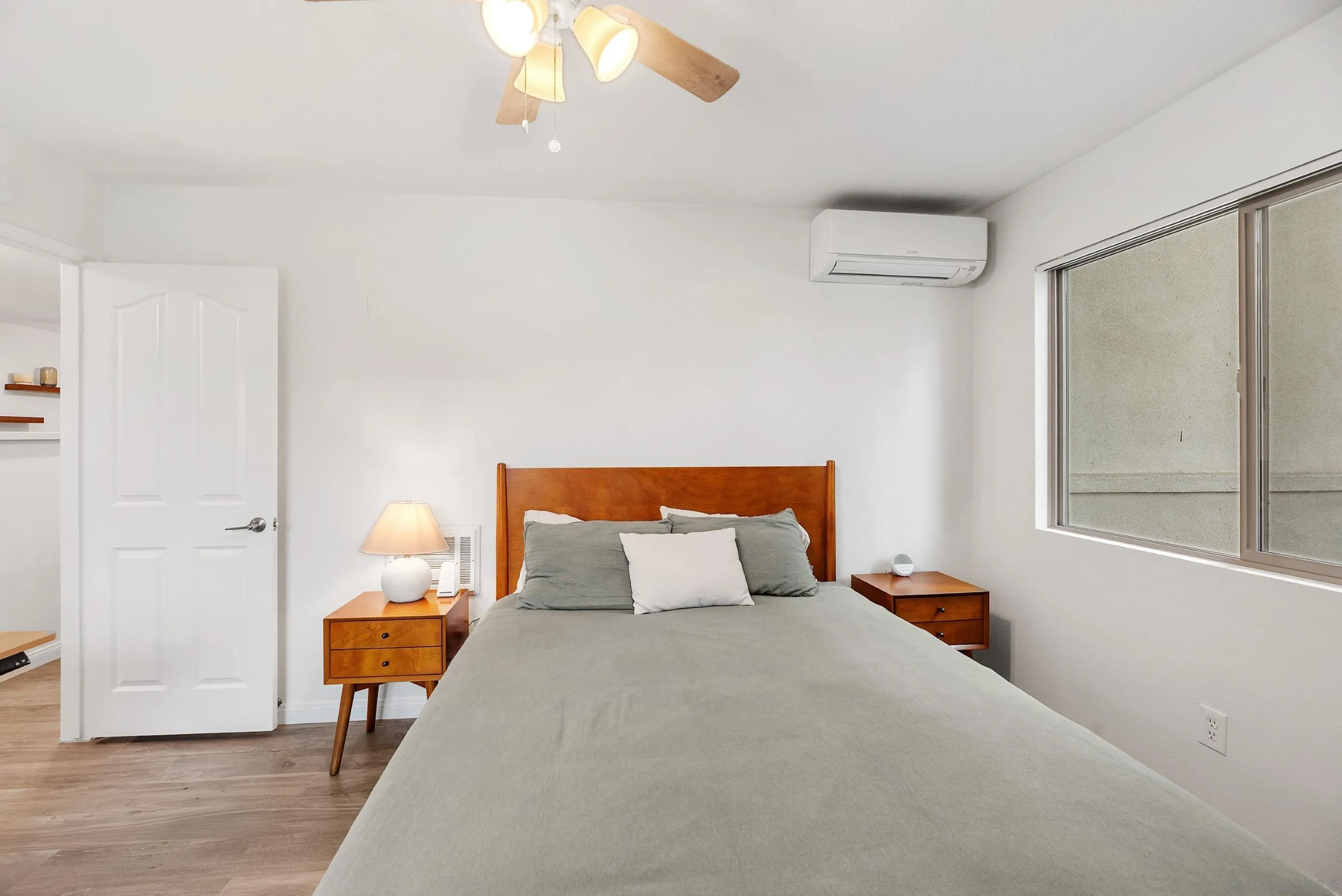 1810 South El Camino Real, Unit 101 Encinitas, CA 92024 - Photo 23 of 39 a bedroom with a bed and window