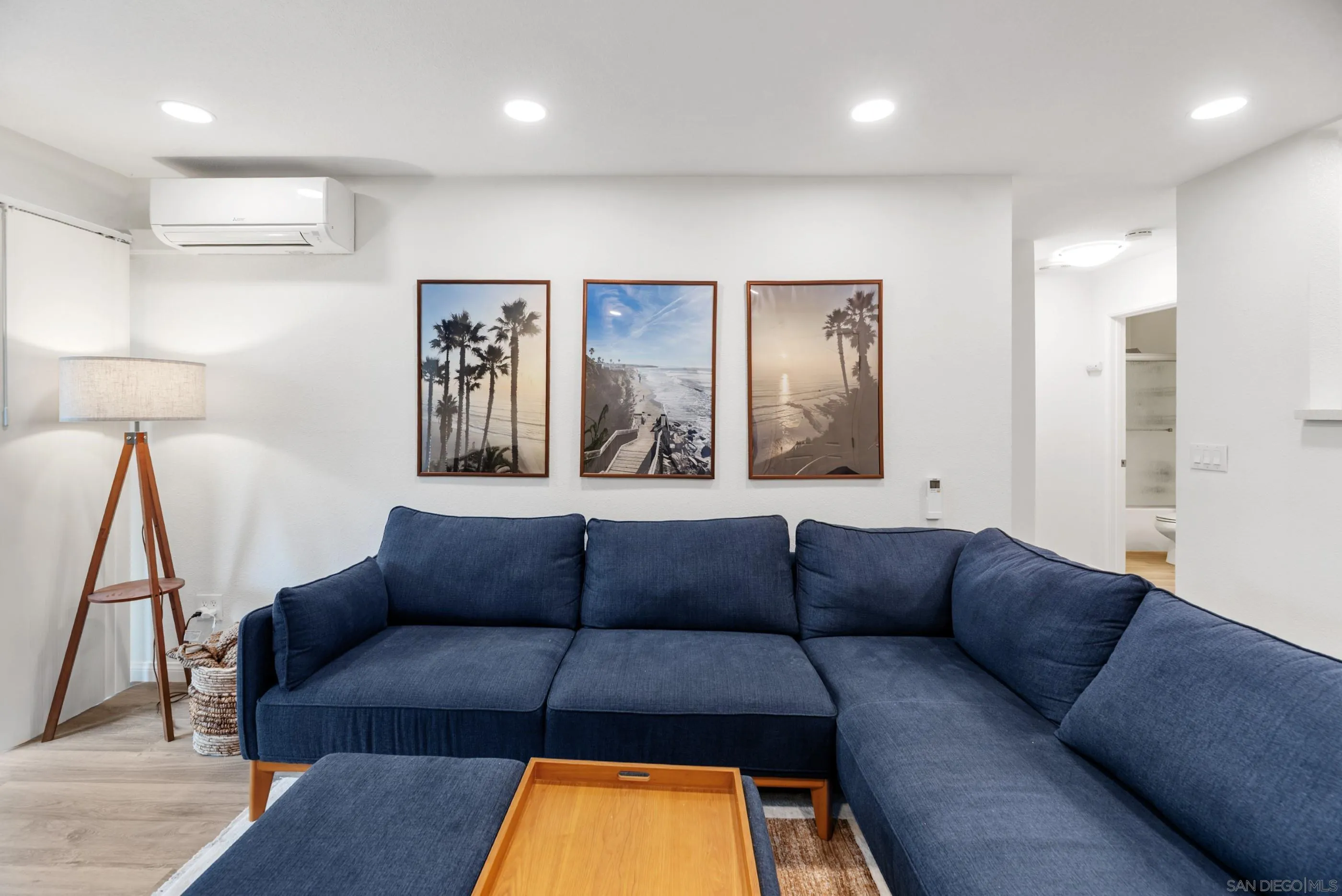 1810 South El Camino Real, Unit 101 Encinitas, CA 92024 - Photo 5 of 39 a living room with furniture and a couch