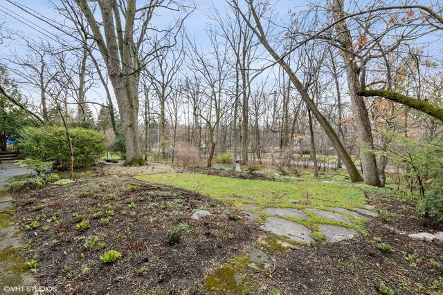 a view of backyard with green space
