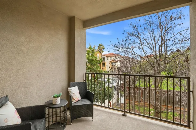 a bedroom with a bed and a lamp