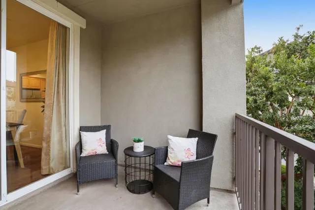 a bedroom with a bed and a table