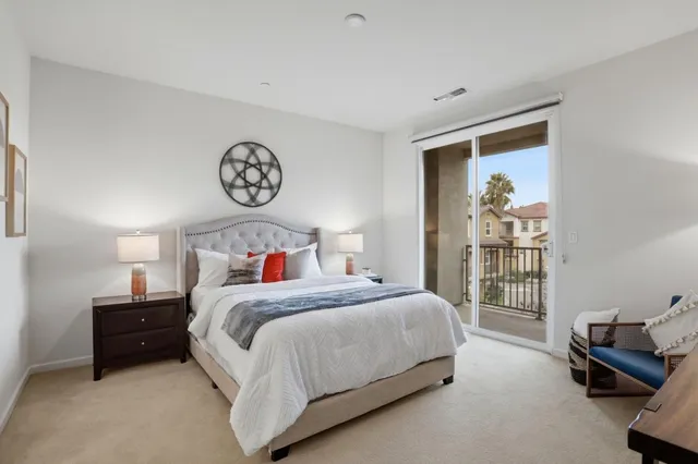 a bedroom with a bed and a table in it