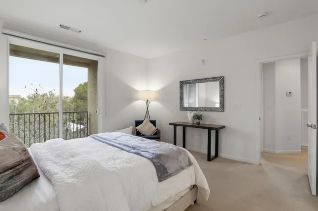 a bedroom with a workspace