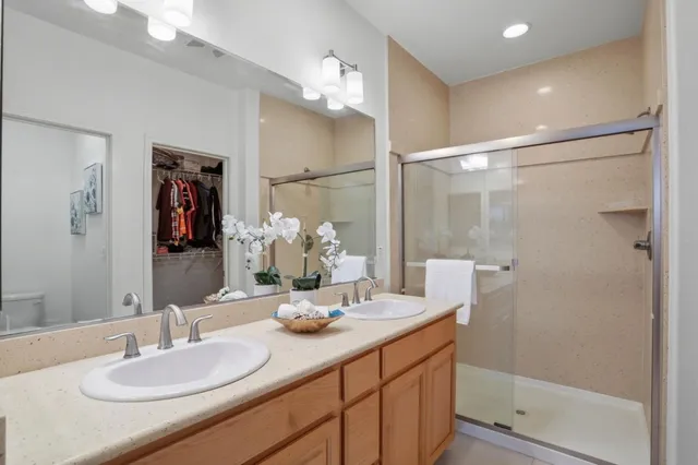a bathroom with a sink vanity mirror and toilet