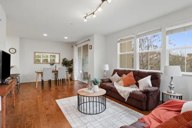 a kitchen with stainless steel appliances granite countertop a refrigerator sink stove microwave and cabinets