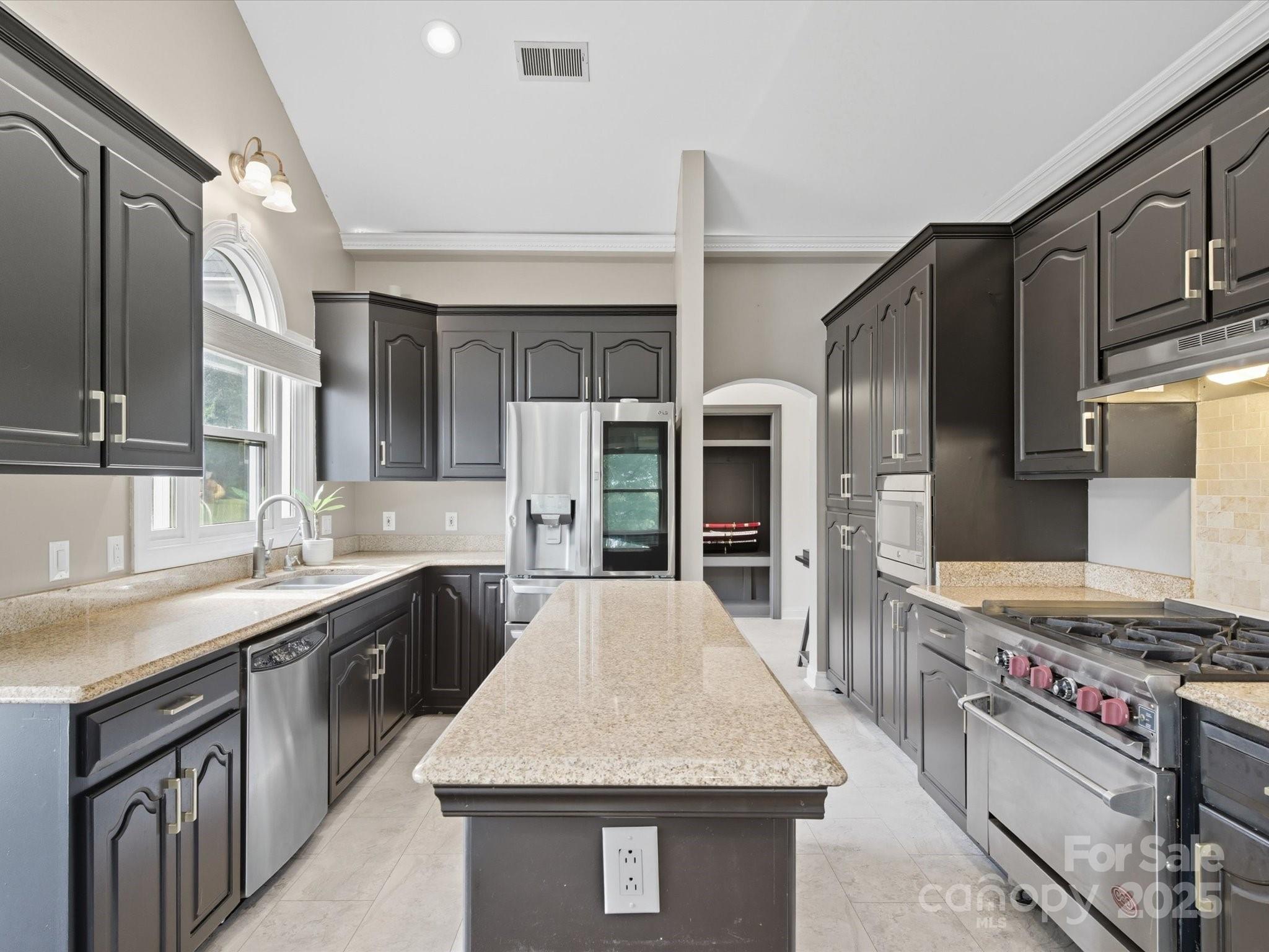 240 Petty Road Gastonia, NC 28056 - Photo 13 of 48 a kitchen with stainless steel appliances a sink stove and refrigerator