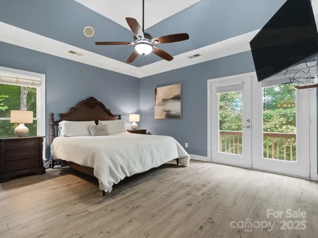 a bedroom with a large bed and a large window