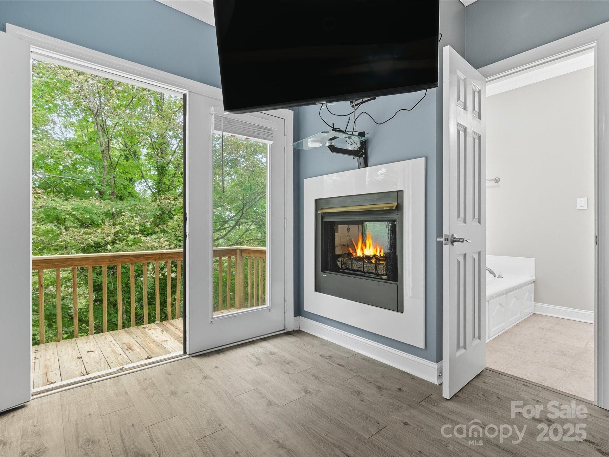 240 Petty Road Gastonia, NC 28056 - Photo 19 of 48 a view of an empty room with wooden floor and fireplace