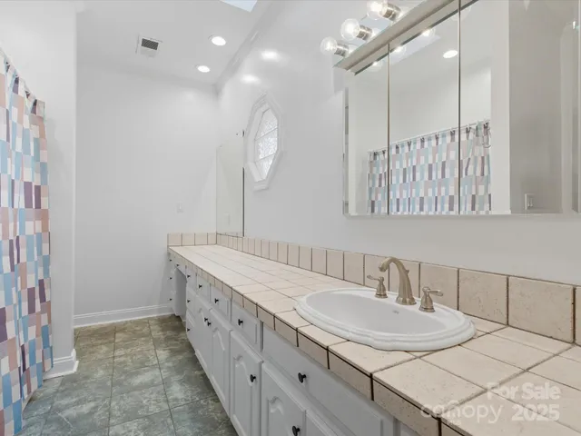 a bathroom with a double vanity sink mirror and double