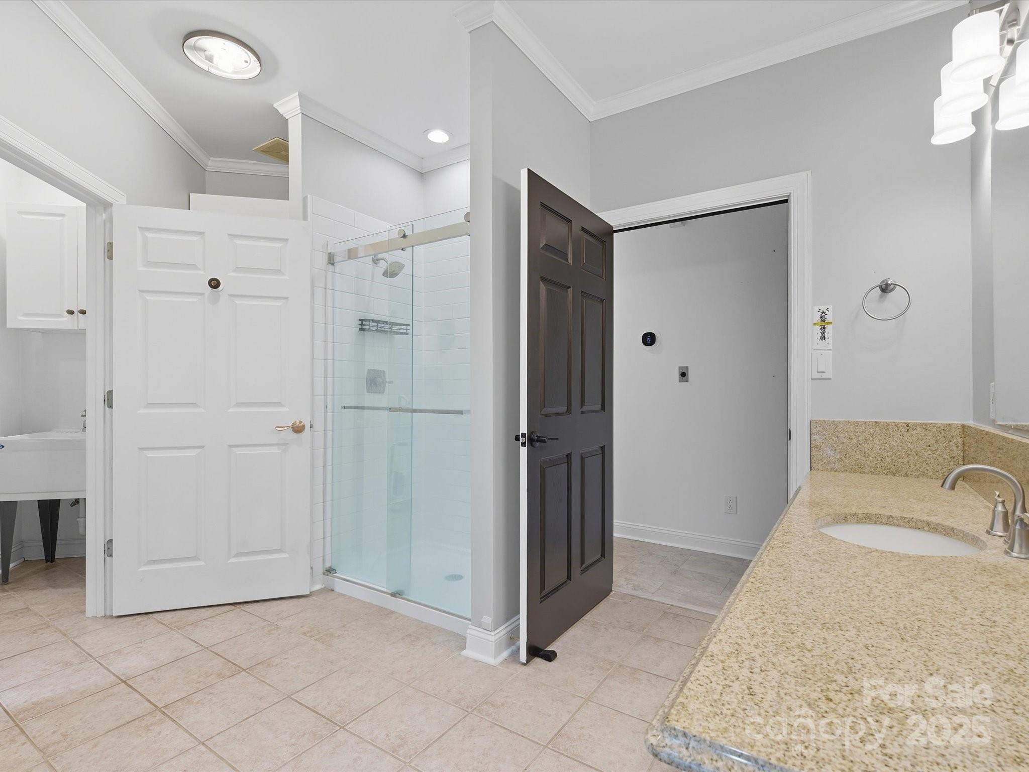 240 Petty Road Gastonia, NC 28056 - Photo 25 of 48 a bathroom with a granite countertop sink a mirror and shower