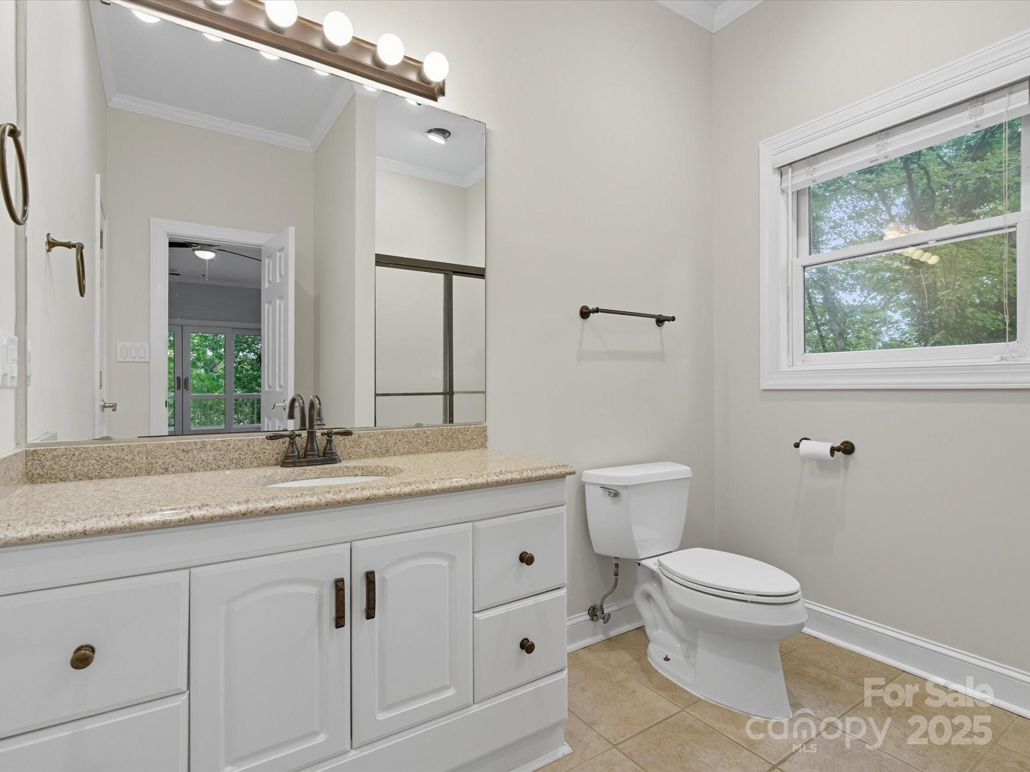240 Petty Road Gastonia, NC 28056 - Photo 32 of 48 a bathroom with a granite countertop toilet sink and mirror