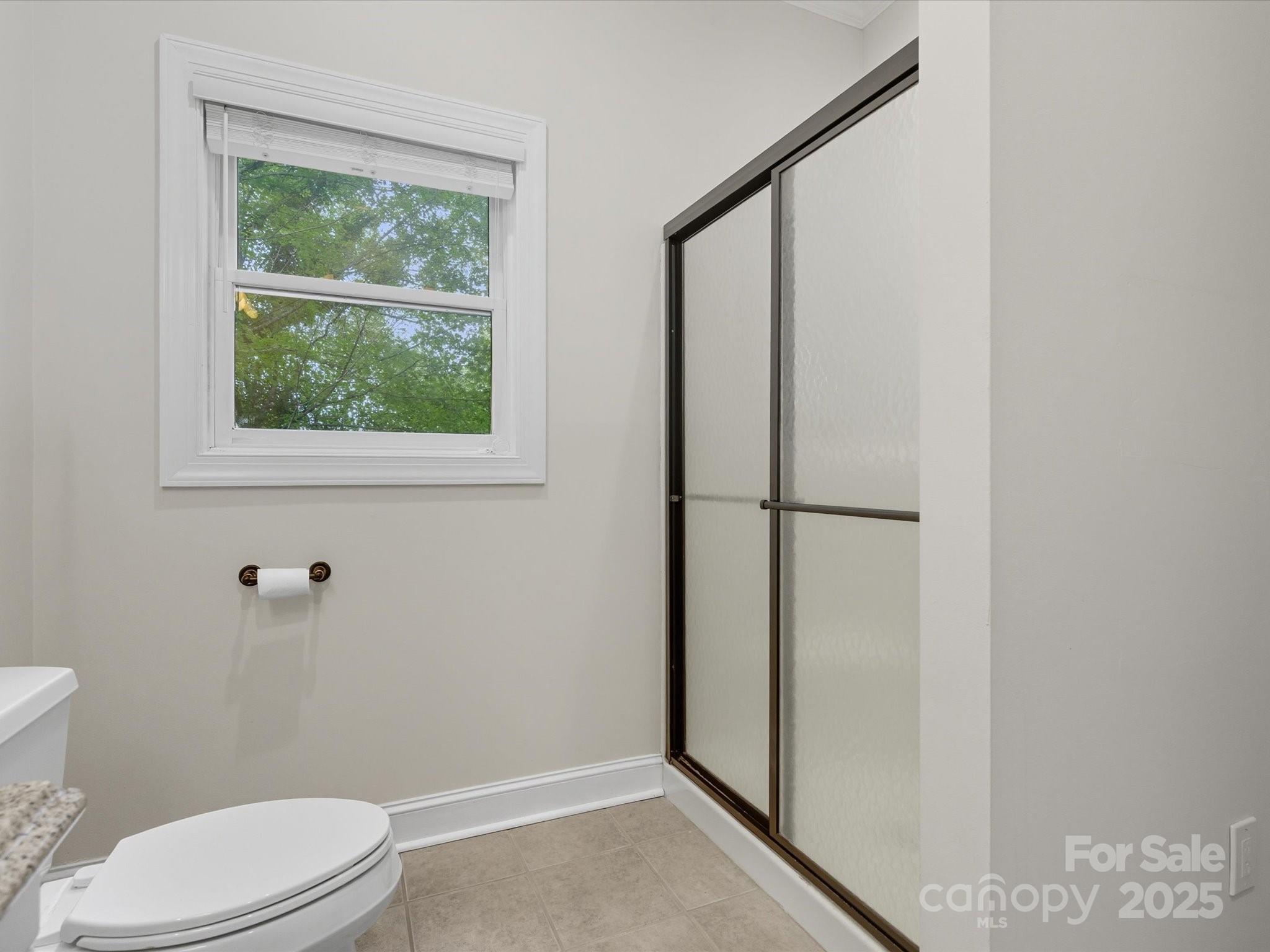240 Petty Road Gastonia, NC 28056 - Photo 33 of 48 a white toilet sitting next to a bathroom sink