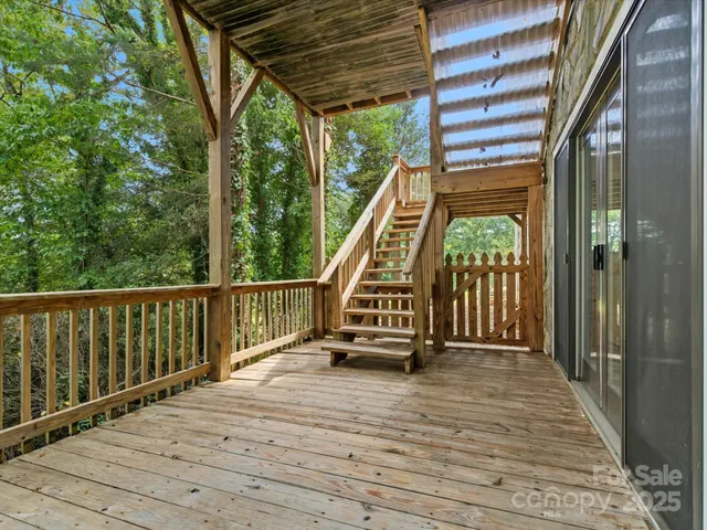 a view of balcony with wooden floor and stairs