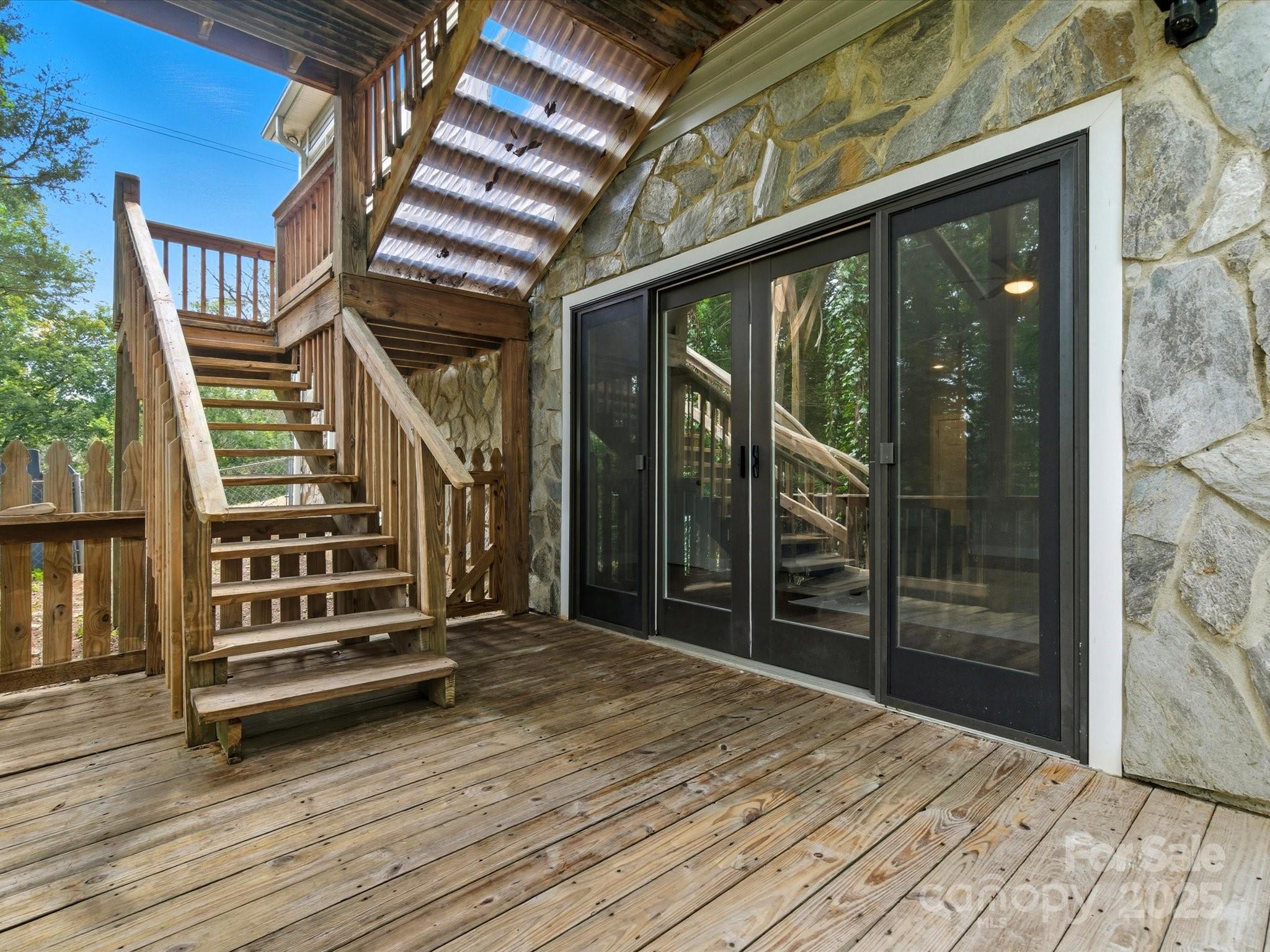 240 Petty Road Gastonia, NC 28056 - Photo 38 of 48 an empty room with wooden floor and windows